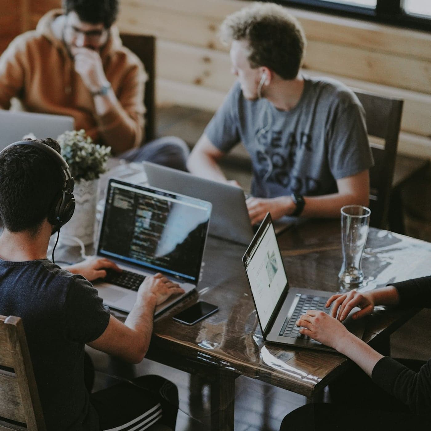Engineers building software together at laptops